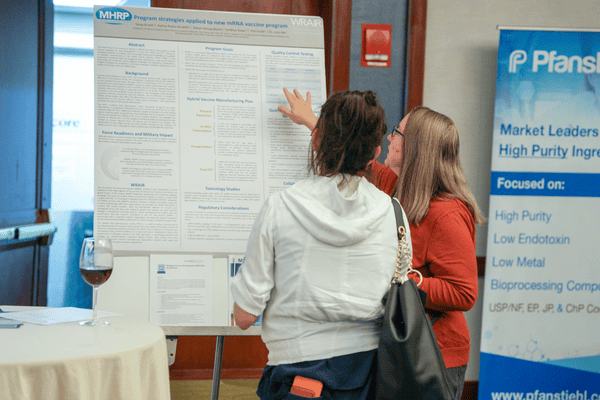Explaining poster at LEAP HR Higher Education